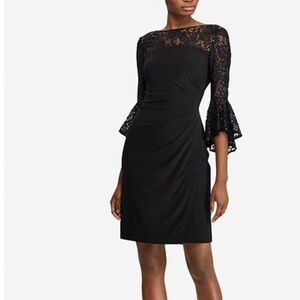 Formal black dress with lace top accents.